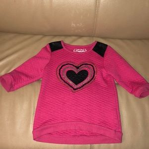 Girls pink sweater with heart in the middle